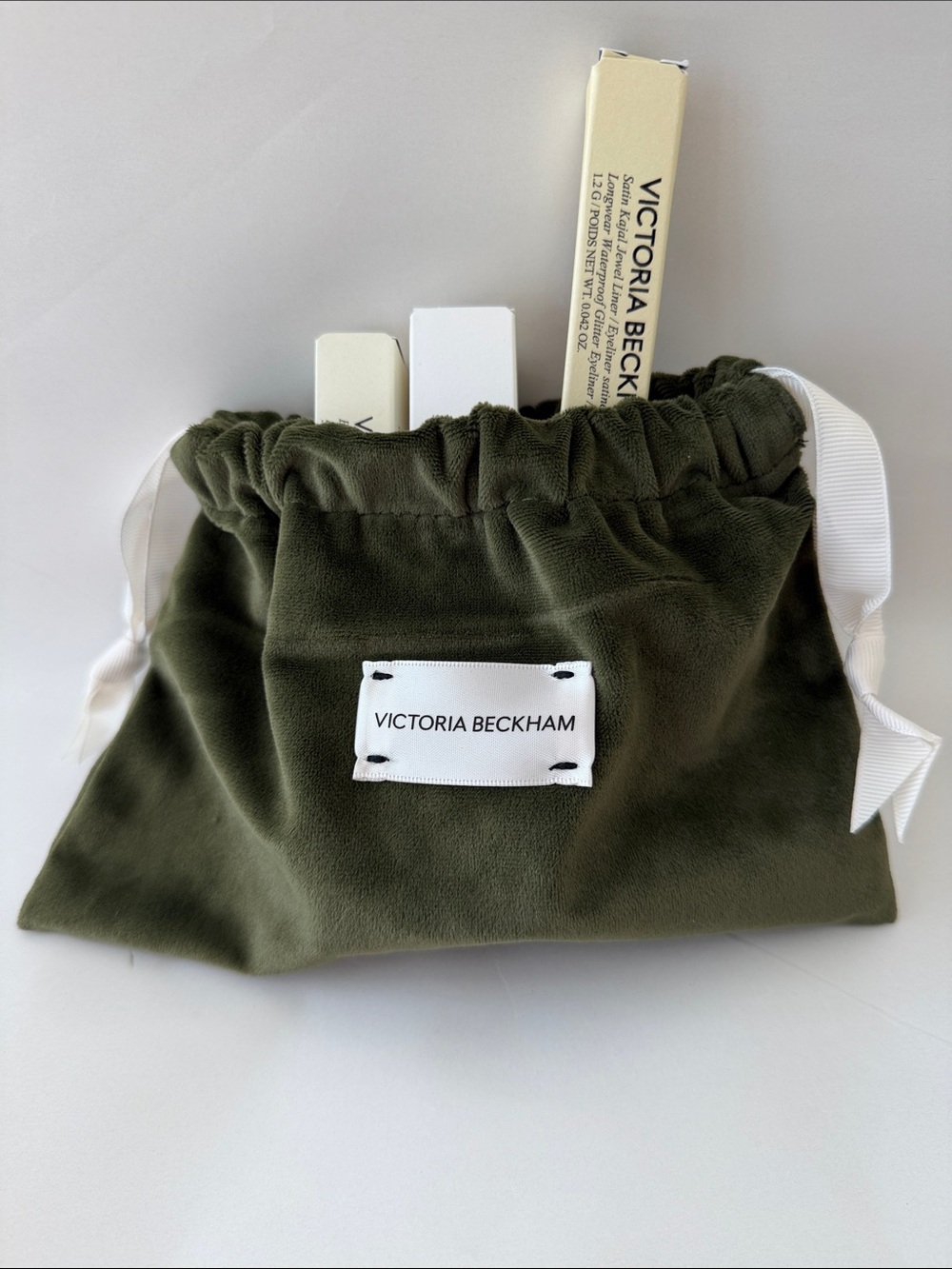 Victoria Beckham olive green cosmetic pouch with white ribbon + empty boxes. New